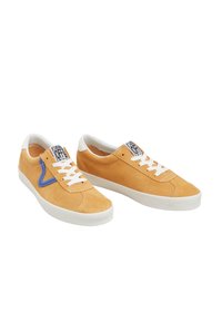 Suede sneakers in light orange with white laces and rubber soles. Features a blue accent on the side and a label on the tongue.