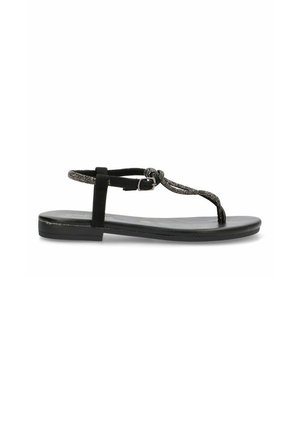 Sandalias planas negras con un diseño de tira T texturizada, que cuentan con un cierre de hebilla y una suela lisa. Construcción simple y minimalista.