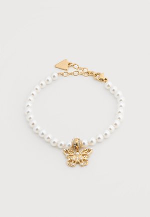 Pearl bracelet with gold chain and clasp, featuring a gold butterfly charm embellished with small pearls and crystals.