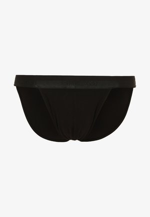 Zwarte katoenen strings met een gladde textuur, voorzien van een merk-elastische tailleband en een contoured pouch-ontwerp.