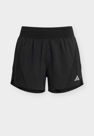 Μαύρα αθλητικά σορτς με φαρδύ λάστιχο στη μέση, πλαϊνές διχτυωτές επιφάνειες και μικρό αντανακλαστικό λογότυπο στο κάτω αριστερό πόδι.