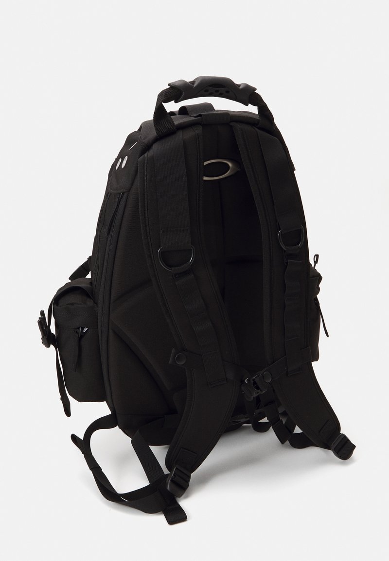 Black backpack with padded back and adjustable straps. Features multiple compartments and a top handle. Made of durable fabric.