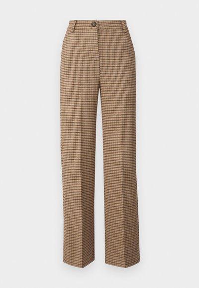 Housut ruskeassa ja beigeissä houndstooth-kuvioissa. Ominaisuudet suora lahje, etupainikekiinnitys ja vyölenkit. Valmistettu teksturoidusta kankaasta.