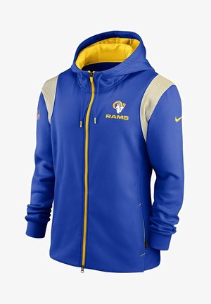 Niebiesko-żółta bluza rozpinana z kapturem Los Angeles Rams z logo drużyny na piersi, łatką NFL na rękawie oraz znakiem Nike na przeciwległym rękawie.