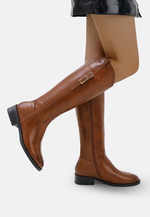 Brown knee-high boots made of smooth leather, featuring a side zipper, a silver buckle accent, and a low block heel.