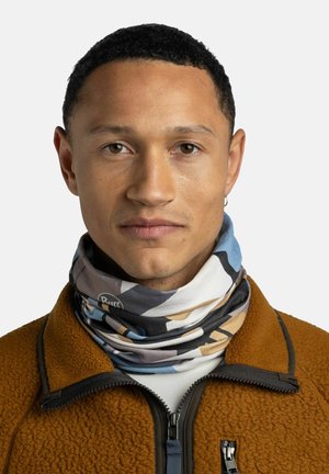 Multicolored neck gaiter featuring abstract patterns in blue, beige, and black, made of soft fabric, worn over a brown fleece jacket.