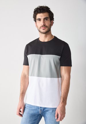 Short-sleeve t-shirt in black, gray, and white color blocks. Made of soft cotton, featuring a crew neck and a classic fit.