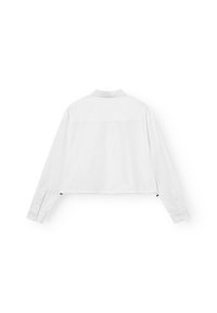 Camicia bianca corta a maniche lunghe con colletto, realizzata in tessuto liscio, caratterizzata da una cucitura sul rétro e polsini con bottoni.