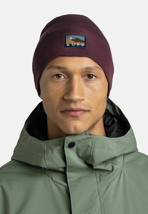 Burgundy knit beanie with a textured finish, featuring a circular patch with mountains and the word "BUFF" in blue and yellow.