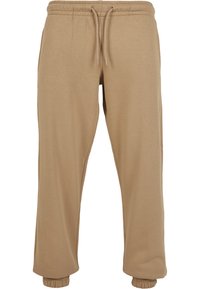 Beige joggebukser laget av myk bomullsblanding, med elastisk midjebånd med snøring og elastiske mansjetter ved anklene.