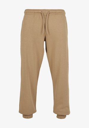 Beežid dressipüksid, mis on valmistatud pehmest puuvillasegust, elastse vöökoha ja paelaga ning elastsete cuffs'idega pahkluudes.