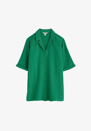 Žalia trumpomis rankovėmis mygtukinė marškinėliai su tekstūruotu paviršiumi, iškarpytu apykakle ir priekiu užsegimu mygtukais. Savybė - laisvas, atsipalaidavęs siluetas.