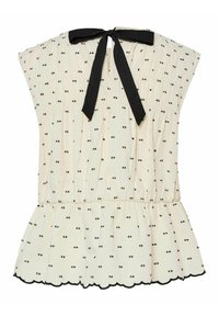 Blusa blanca con lunares negros, diseño plisado, dobladillo ondulado y un lazo negro en la parte trasera. Tejido suave con un corte relajado.