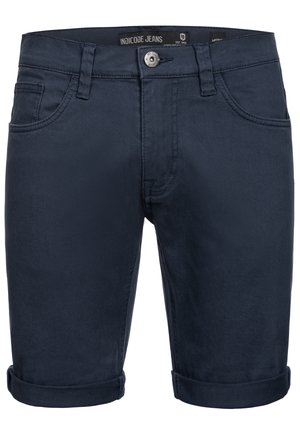Marineblå denimshorts med en glat tekstur, der har opfoldede manchetter, fem-lomme design og en sølvknap lukning i taljen.
