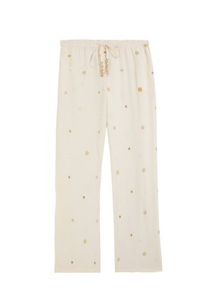 Pantalones holgados de color crema con cintura elástica y bordado floral dorado disperso por toda la tela.