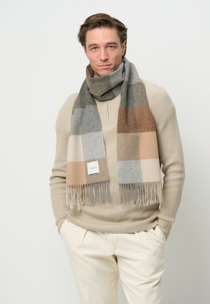 Wollen sjaal in een ruitpatroon met grijze, beige en bruine tinten. Afgewerkt met franjes en een klein label aan één kant.