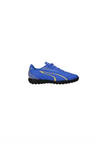 Scarpe sportive sintetiche blu con dettagli gialli, caratterizzate da un design con lacci e una suola in gomma nera testurizzata. Nessun logo o motivo visibile.