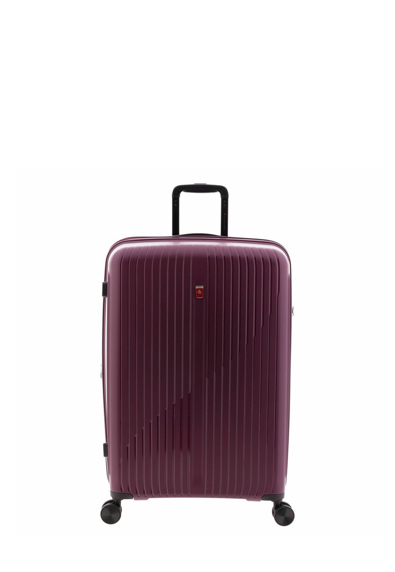 Hard-shell suitcase in purple with vertical ridges, a retractable black handle, and four black wheels for mobility.