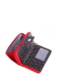 Red wallet with black interior featuring colorful polka dots. Includes card slots, a zippered compartment, and a transparent ID window.