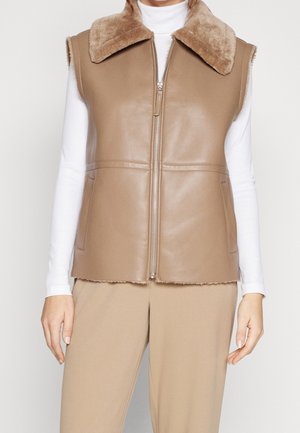 Bruin leren vest met een faux fur kraag, mouwloos ontwerp, ritssluiting en zijzakken. Heeft een gladde textuur en een cropped lengte.