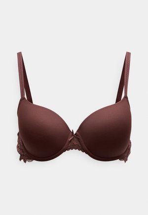 Pruun polsterdatud rinnahoidja pitsiliste detailide ja reguleeritavate rihmadega; sile kangas, kõver kujundus ja väike lips keskel.