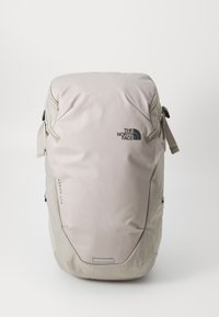 Light gray backpack made from durable fabric with smooth texture. Features a logo, adjustable straps, and multiple compartment zippers.