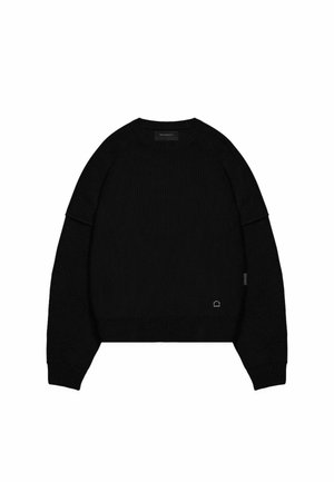 Black knitted sweater with a crew neckline and dropped shoulders. Features ribbed texture and subtle logo detail on the hem.