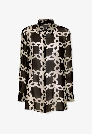 Blouse noire transparente avec un motif de chaînes blanches géométriques, manches longues, col et fermeture à boutons devant. Tissu doux et léger.