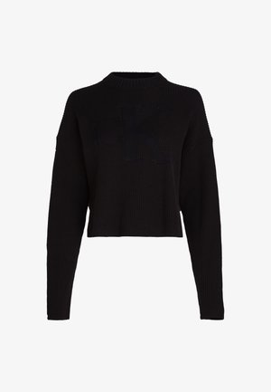Svart cropped genser med ribbet tekstur, vide ermer og en subtil "CK" logo på fronten. Har høy, rund hals.