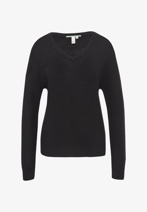 Mustuhall kangas, V-kaelus, pikad varrukad, tekstureeritud kudum ja soonilised servad ja mansetid. Lihtne, mugav disain, mis sobib kihilise kandmise jaoks.