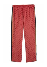 Røde mønstrede sweatpants med snoretræk i taljen, sorte sidelængder og gule accenter, som har geometriske designs over hele.