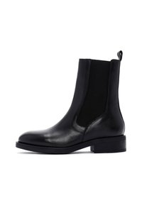 Bottines en cuir noir avec des panneaux élastiques sur les côtés, un bout rond, un talon carré court et une languette pour un enfilage facile.