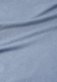 Light blue ribbed fabric displaying a smooth texture and slightly stretchy material with vertical lines. Suitable for various clothing items.