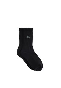 Calcetines negros de canalé con una textura suave, que presentan un pequeño bordado de una bicicleta multicolor en el lateral.