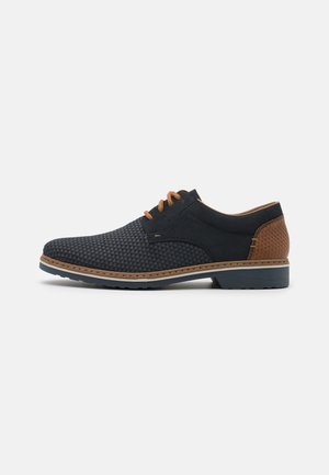 Black textured shoes with a triangular pattern, brown leather accents, and contrasting beige laces. Features a durable rubber sole.