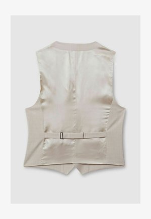 Beige vest med en glat satinryg og en struktureret stofforfront. Har et bagbælte med en metalspænde og en buet kant.