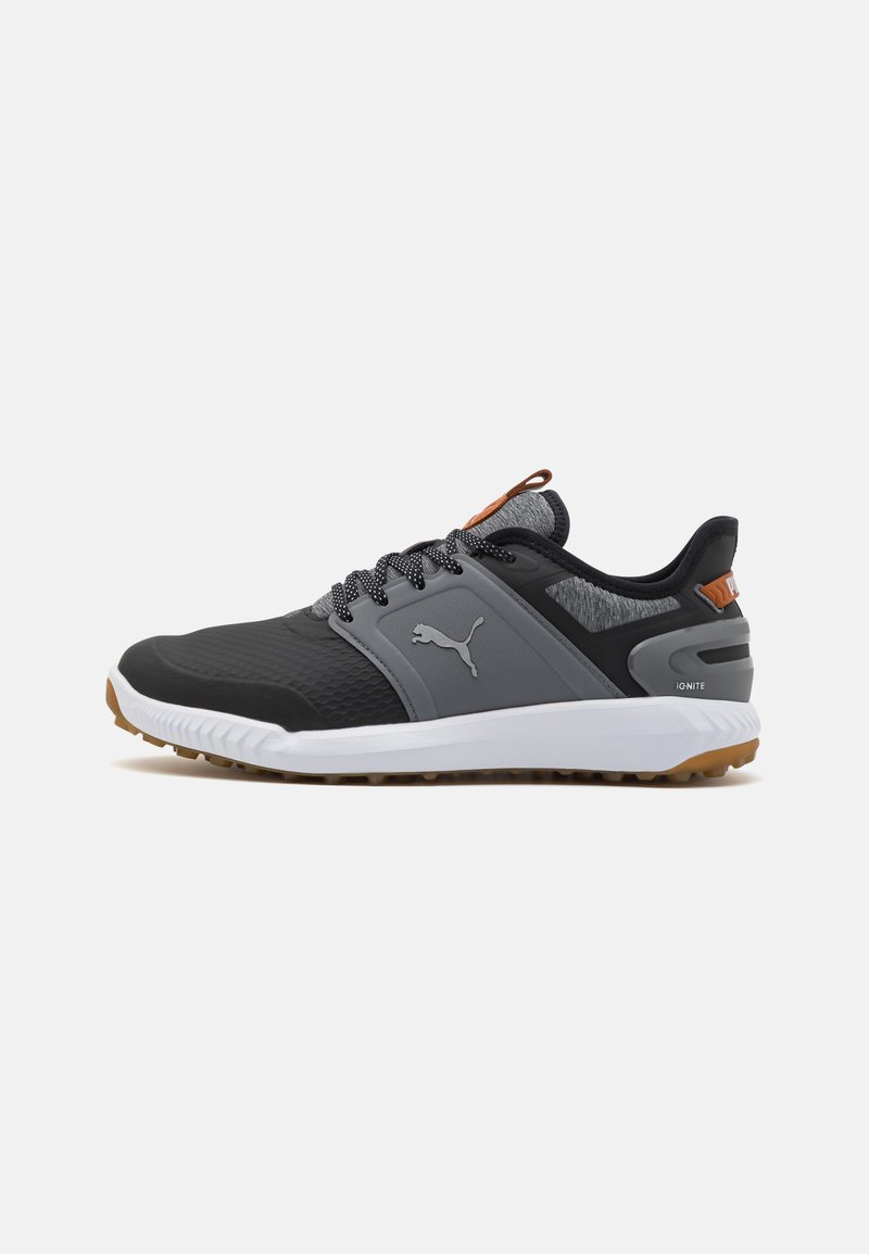 Black and gray athletic shoes featuring a textured upper, white midsole, rubber outsole, and fabric accents on the collar and tongue.
