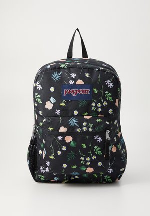 Zwarte rugzak met bloemenpatronen in pastelkleuren. Beschikt over een hoofdcompartiment, een voorzak met ritssluiting en een zijnetzak. Jansport-logo zichtbaar.