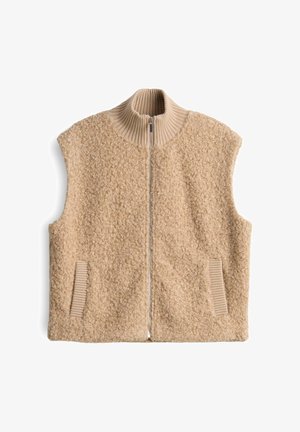 Beige ärmellose Weste aus strukturiertem, flauschigem Material. Hoher Kragen mit durchgehendem Reißverschluss, mit gerippten Strickakzenten am Kragen und den Taschen.