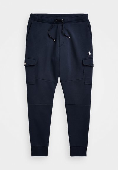 Marineblå sweatpants i bomullsblandning, med dragsko i midjan, två sidofickor och en liten logotyp på vänster lår.