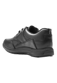 Black leather sneaker with a smooth finish, rounded toe, padded collar, and textured sole. Features lace-up design and heel tab.