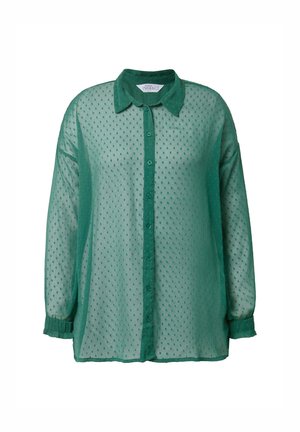 Camicia verde semitrasparente realizzata in tessuto leggero, dotata di apertura con bottoni, colletto classico e motivo a pois testurizzati con maniche lunghe.