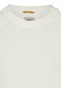 Off-White Sweatshirt mit rundem Ausschnitt, Raglanärmeln und strukturierter Stoffoberfläche. Ein kleines braunes Akzenttag ist in der Nähe des Ausschnitts sichtbar.