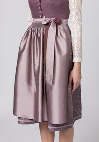 Purple satin skirt with a smooth texture, smocked waistband, and fabric belt. Features detailed floral patterns at the hem. White lace sleeve visible.