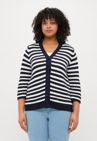 Navy and cream striped cardigan with three-quarter sleeves, V-neck, five buttons, and ribbed hem. Soft knit fabric with a textured finish.