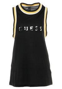 Svart ärmlös tanktopp med rund halsringning, gula och vita ränder, samt glänsande "GUESS"-tryck över framsidan.