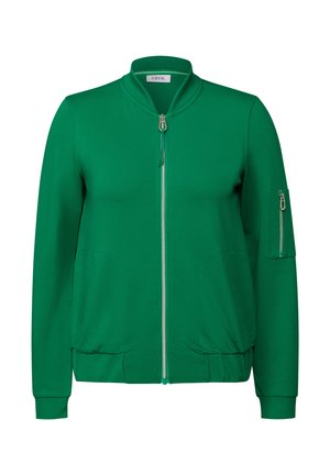 Green zip-up jacket with a stand collar, long sleeves, side pockets, and a zippered pocket on the left sleeve. Soft fabric texture.