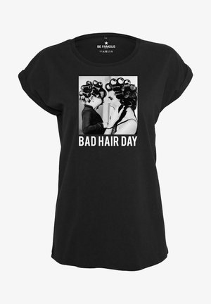Black short-sleeved t-shirt with rounded neckline featuring a photographic design of two figures in rollers and the text "BAD HAIR DAY" below.