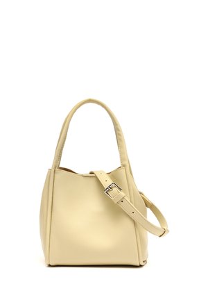 Cream-colored leather handbag with a single top handle and a detachable adjustable shoulder strap with a silver buckle.