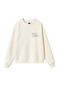 Cremefarvet sweatshirt med raglanærmer, ribbede manchetter og et lille trykt design på forsiden. Lavet af blødt, struktureret stof.